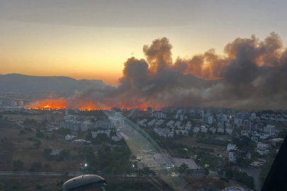 Mersin'de yerleşim yeri yakınında çıkan yangın, büyümeden kontrol alltına alındı